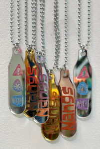 Nitrous oxide charger shaped mirror acrylic on a chain with either 'Nangs' or '!, *, N20' on them in a variety of colours